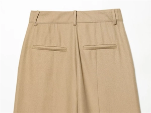 Detail of khaki slim-fit trousers showing rear double-welt pockets and belt loops