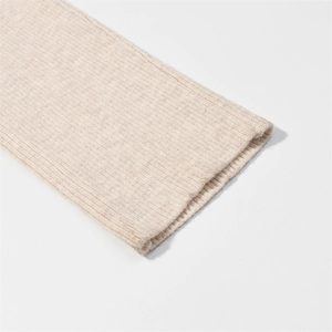 Close-up of beige ribbed knit cuff showing detailed fabric texture and premium stitching
