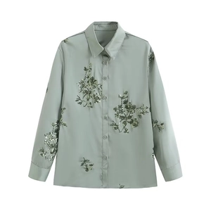Sage green satin long-sleeve shirt featuring intricate floral sequin embroidery details