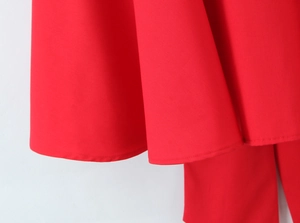Close-up of sweet red mini dress showing refined hem stitching and quality fabric texture.