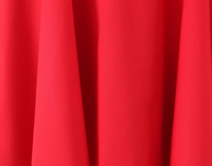 Macro detail of vibrant red fabric texture for elegant sexy bow mini dress material