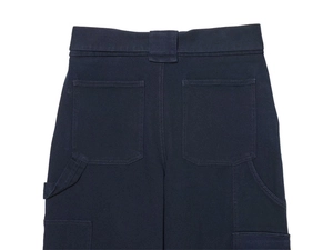 Close-up of winter cargo pants back pockets and belt loops in navy blue twill fabric
