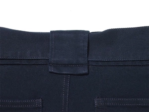Close-up of belt loops and high-density twill fabric on navy blue winter cargo pants