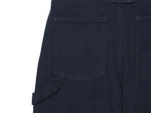 Detail of navy blue cargo pants featuring a hammer loop, back pocket, and durable stitching