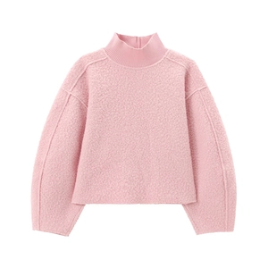 Detail of pink fleece sweatshirt showing textured sherpa fabric and ribbed collar