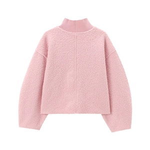 Close-up of pink sherpa fleece texture on a loose-fit mock neck sweatshirt for women