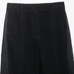 Pantalon en jean noir à taille haute pour femme avec des franges latérales tendance