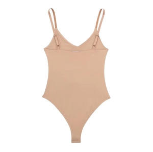 Detailed view of beige deep V-neck bodysuit with adjustable spaghetti straps on white background
