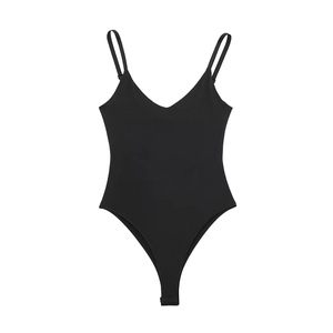 Flat lay of a minimalist black V-neck bodysuit with thin spaghetti straps on white background