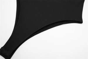 Detail view showing high-cut leg opening and double-needle stitching on black bodysuit