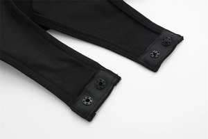 Detail view of the black knit bodysuit crotch featuring four durable snap button fasteners