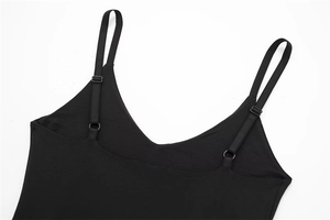 Detail of adjustable straps and V-neckline on a black nylon bodysuit for women