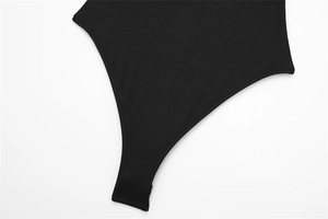 Detail of high-stretch black bodysuit with high-cut design and seamless bottom closure