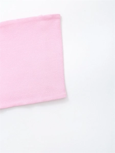 Detail of pink ribbed knit fabric showing soft texture and vertical stripe pattern