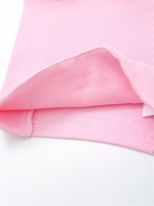 Close-up of pink ribbed knit fabric texture and high-quality hem stitching details