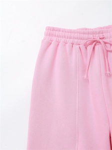 Detail of elastic drawstring waistband and stitching on baby pink jogger pants