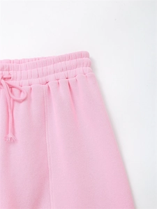 Detailed close-up of pink jogger waist featuring elastic band and drawstring texture
