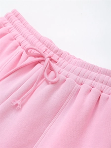 Macro detail of pink knit jogger waistband featuring elastic band and flat drawstring