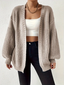 Chunky knit beige oversized cardigan with balloon sleeves and a relaxed casual fit