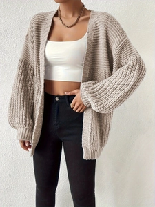 Oversized oatmeal knit cardigan featuring chunky texture and cozy balloon sleeves for women