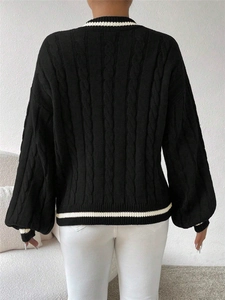 Women's cable-knit black cardigan sweater with white stripe trim and round neckline