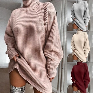 Close-up of thick ribbed knit texture on oversized raglan sleeve sweater dress