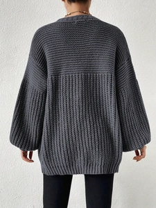 Detailed back view of charcoal grey oversized knit cardigan with rib-knit texture