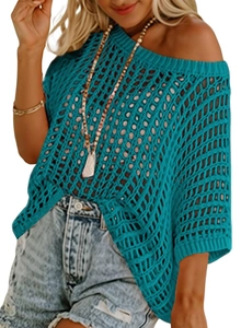 Detail of teal crochet hollow-out knit texture on a summer beach cover-up top