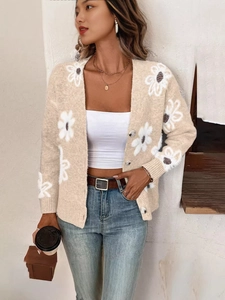 Cardigan en maille beige avec grands imprimés de marguerites et fermeture boutonnée