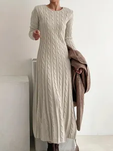 Elegant cream cable-knit long sleeve sweater dress with a minimal A-line silhouette