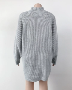 Detailed knit texture and ribbed cuffs of this light grey mock neck sweater dress