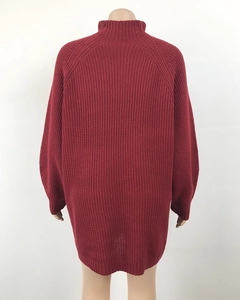 Detail view of the back of a dark red oversized turtleneck knitted sweater dress