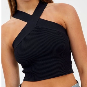 Slim fit black ribbed knit crop top featuring a criss-cross halter neck design for women