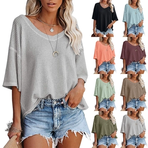 Detail of waffle knit texture and varied color options for women's V-neck loose t-shirt