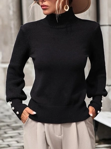 Women's black mock neck knit sweater with elegant pearl button details on the cuffs