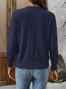Back view of a navy blue long sleeve knit cardigan with ribbed cuffs and hem