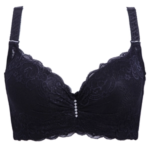 Detail of black lace bra cup showing intricate floral patterns and crystal accents