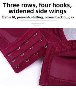 Detail of burgundy lace bra showing four-row hook-and-eye closure and wide side wings