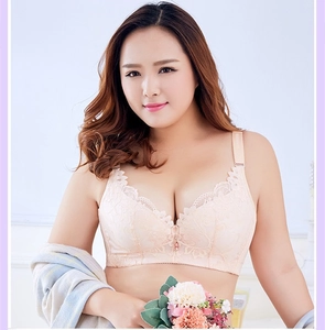 Close-up of pink lace bra featuring floral embroidery and teardrop gemstone pendant