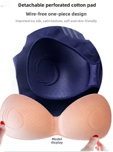 Detail of breathable perforated removable pads for seamless sports brassiere