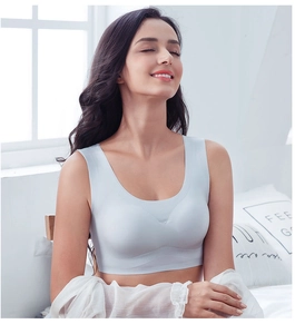 Detail of light blue seamless sports bra with wide straps and high elasticity fabric