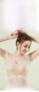 Detail of nude seamless sports bra featuring wide straps and SUPRE ME STYLE elastic band