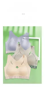 Detail of seamless sports bras in pastel colors with wide branded elastic waistbands
