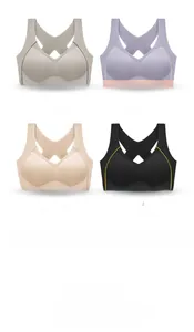 Detail view of four seamless sports bras with criss-cross back straps in multiple colors