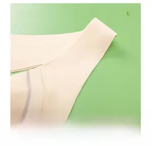 Detail view of seamless beige sports bra showing the wide pressure-relieving shoulder straps