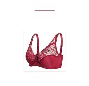 Macro shot of wine red lace cup with heart pendant detail on underwire bra