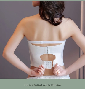 Detail of white strapless tube top bra featuring a wide multi-row back hook and eye closure