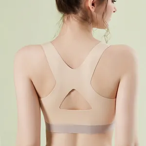 Seamless plus size sports bra in nude color with wide straps and racerback design