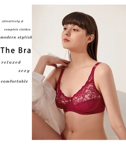 Detail of burgundy lace bra with floral patterns and adjustable wide shoulder straps