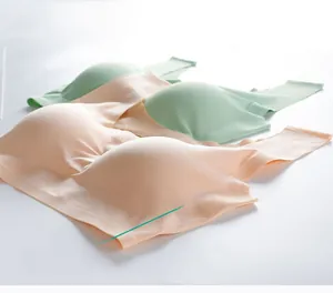 Close-up of seamless push-up bras in pale green and beige showing high elasticity fabric